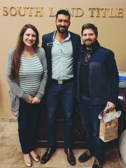 Cory Elliott Burke with clients on closing day