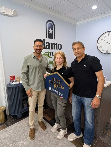 Cory Elliott Burke with clients on closing day