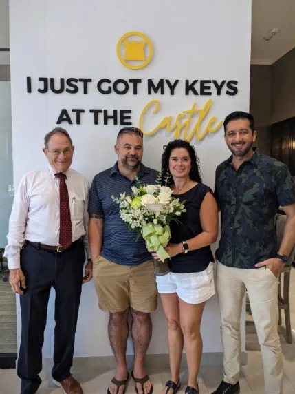Cory Elliott Burke with clients on closing day